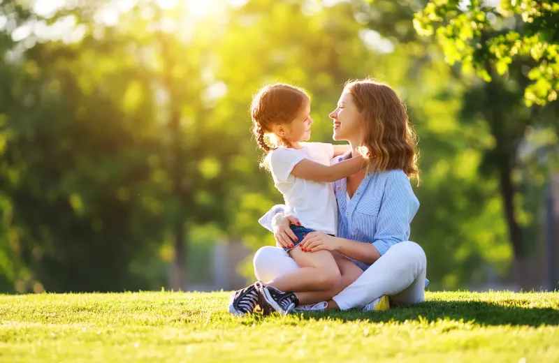mother and daughter on lawn